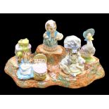 Five Beswick Beatrix Potter Figures, housed on a porcelain stand, figures comprising Mr.