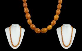 Early 20th Century Fine Quality Butterscotch Amber Beaded Necklace of Graduated Form. c.1920's.