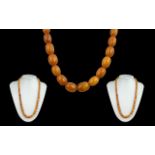 Early 20th Century Fine Quality Butterscotch Amber Beaded Necklace of Graduated Form. c.1920's.