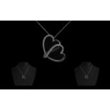 18ct White Gold Diamond Heart Shaped Pendant suspended on a fine box link chain.