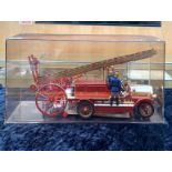A Diecast Model of a 1914 Dennis Fire Engine, housed in a perspex box,