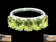 Peridot Half Eternity Ring, five oval cut, bright, sparkling peridots, totalling 4cts,