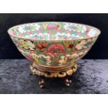 An Oriental Floral Decorated Bowl, 9" diameter, marked Empire to base, on carved wooden stand.