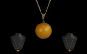 Antique Period Large 9ct Gold Mounted Butterscotch Amber Bead/Pendant Drop, marked 9ct. Attached