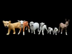 A Collection of Beswick Figures including two sheep and two lamb figures,