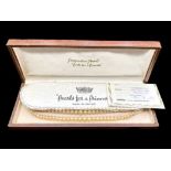 Two Row Pearl Necklace by 'Pompadour Pearls', with stone set clasp, in fitted box.