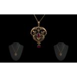 Antique Period Attractive 9ct Gold Openworked Garnet Set Pendant with attached later 9ct gold chain.