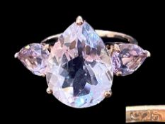 Amethyst Trilogy Statement Ring, the largest, central amethyst, a pear cut of 7.