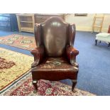 Oxblood Leather Chesterfield Style Armchair, studded edges, raised on short cabriole legs.