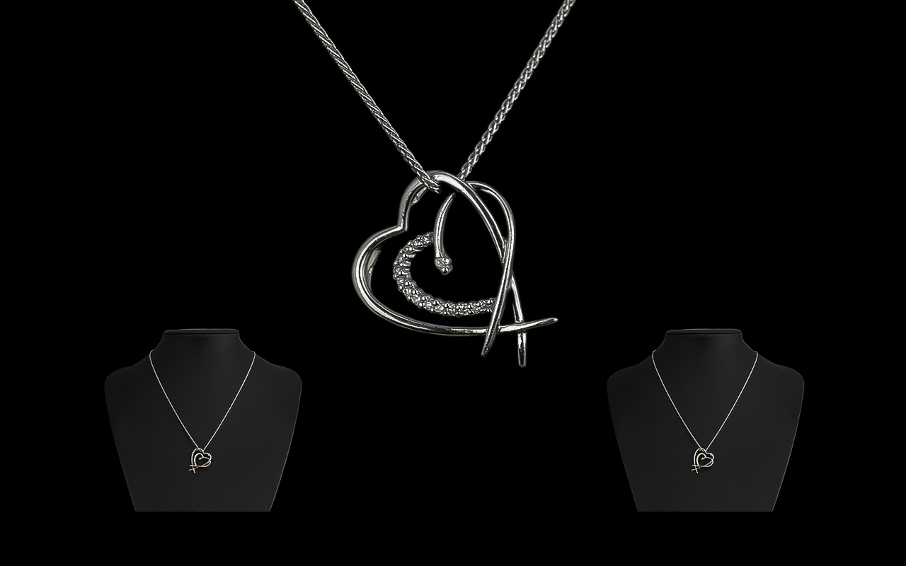 18ct White Gold Contemporary Diamond Set Heart Shaped Pendant with Attached 18ct White Gold Chain.