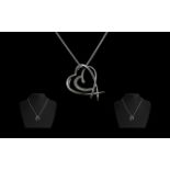 18ct White Gold Contemporary Diamond Set Heart Shaped Pendant with Attached 18ct White Gold Chain.