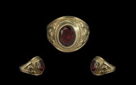 10ct Gents Gold, Garnet Set College Ring - Of Heavy Cast Ornate Shank. Marked 10ct.