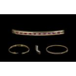 10ct Gold - Attractive Ruby and Diamond Set Hinged Bangle. Marked 10ct.