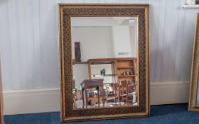 Large Antique Mirror with decorative wooden frame, bevelled glass edges, measures approx 38" x 32".