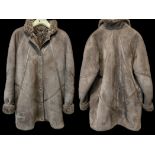 Ladies 3/4 Sheepskin Coat, Mink Colour, popper fastening, leather trims, two side pockets.