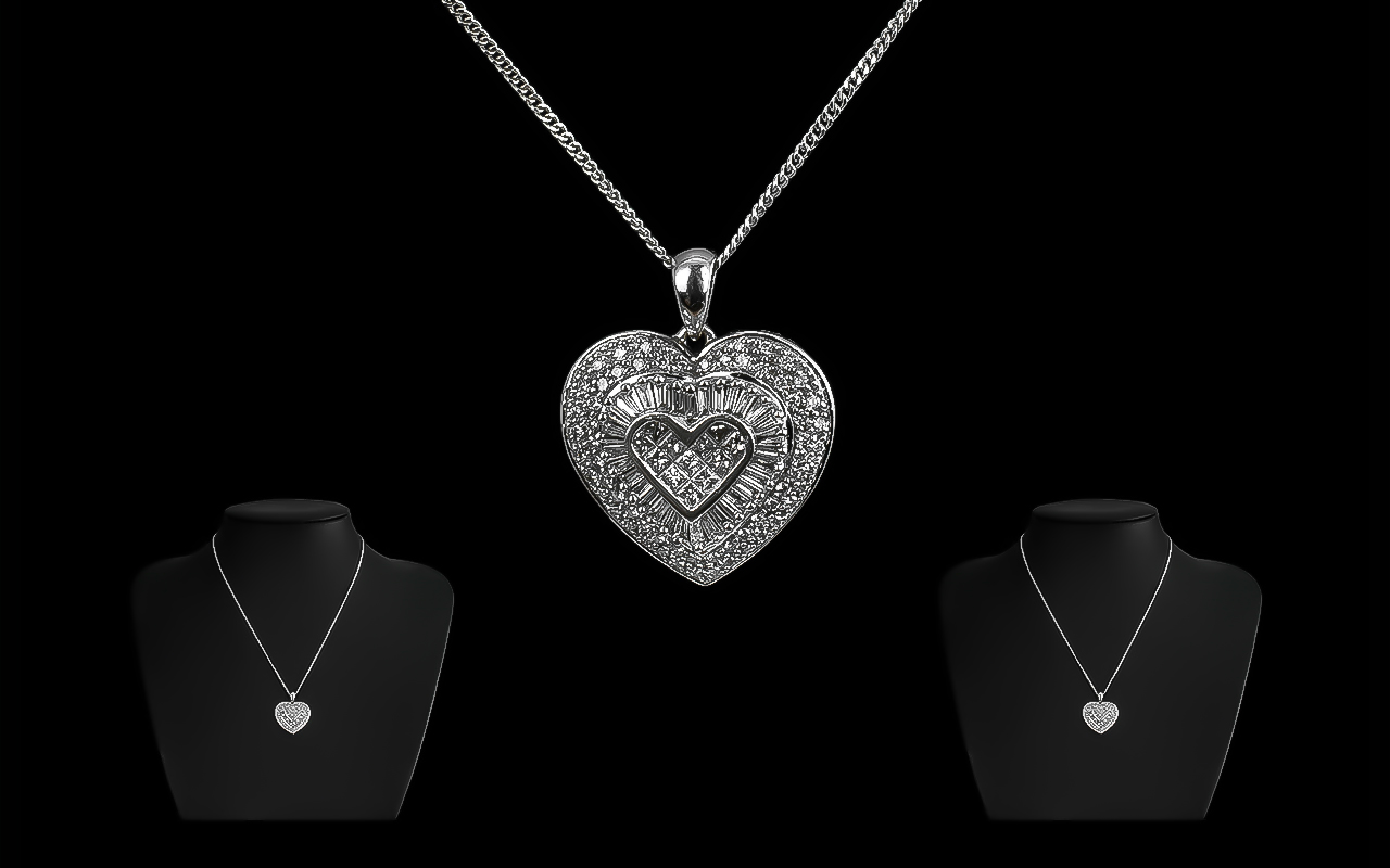 14ct White Gold Attractive Diamond Set Heart Shaped Pendant with Attached 9ct Gold Marked Chain.
