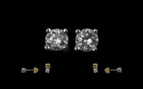 A Pair of 9ct Gold Diamond Set Studs, good colour and clarity, for pierced ears.