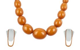 Early 20th Century Long Graduated Amber Beaded Necklace. Length 32 Inches, Weight 71.3 grams.