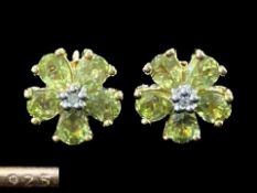 Peridot and Diamond Floral Stud Earrings, the five peridot set 'petals', with a diamond to the