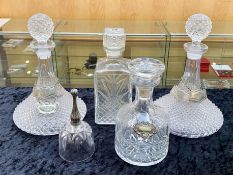Four Glass Decanters, including two Ship's Decanters, a square decanter and a round decanter,