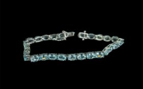 Sky Blue Topaz Tennis Bracelet, a row of bright, sparkling, oval cut, sky blue topaz,