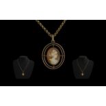 9ct Gold Cameo Pendant, central Cameo encircled by two oval gold rings,