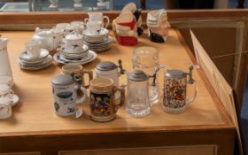 Collection of Tankards, including two pewter lidded German tankards, two pottery Tankards,