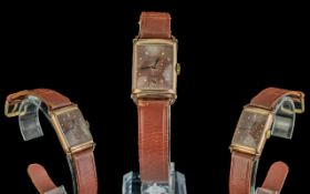 Bulova Ladies 14ct Gold Filled Mechanical Wrist Watch From The 1930's with tan leather strap in
