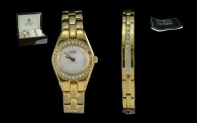 Ladies Eco Drive Quartz Watch and Bracelet Set The timepiece features a silver dial and a cubic