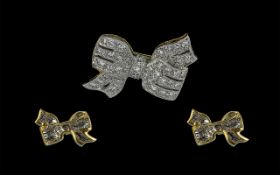 18ct Gold Attractive Diamond Set Brooch In the Form of a Ribbon Bow.