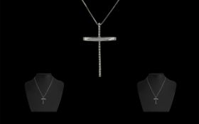 18ct White Gold Diamond Set Cross suspended on an 18ct fine gold box link chain. Fully hallmarked.