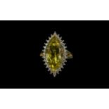 Green Gold Quartz Halo Ring, an 8ct marquise cut green gold quartz,