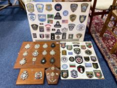 Large Quantity of Police Badges, mounted on boards,