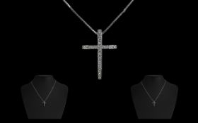 18ct White Gold Diamond Cross and Chain the pendant set with round brilliant cut diamonds. suspended