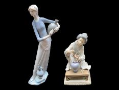 Two Lladro Figures, depicting a water carrier, lady carrying water bottles, measures 13" tall,