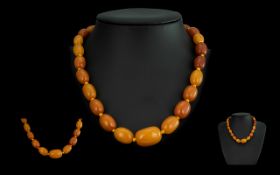 A Superb Quality 1920's Graduated Butterscotch Amber Beaded Necklace, Each Bead Knotted.