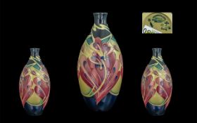 Moorcroft Bottle Shaped Tubelined Modern Vase. c.2008. Floral Design on Black Ground.
