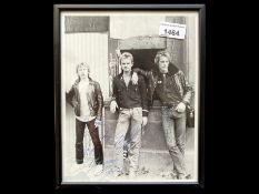 Framed Photograph of The Police, with signatures in pen. Measures 10.5" x 8.5".