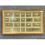 Framed Display Containing 18 Miniature Replica Guns. Overall size including case 20" x 34".