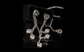 Swarovski Zirconia Set Triple Drop Earrings, each earring comprising three bezel set, heart cut,
