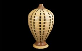 Beautiful Contemporary Hand Turned Wooden Table Lamp, when lit sends out a lovely pattern.