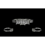 18ct White Gold - Excellent 3 Stone Emerald Cut Diamond Ring.