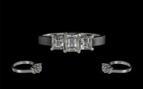 18ct White Gold - Excellent 3 Stone Emerald Cut Diamond Ring.