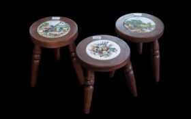 Three Modern Milking Stools, inlaid with porcelain tiles, on turned supports. 11.5" tall.
