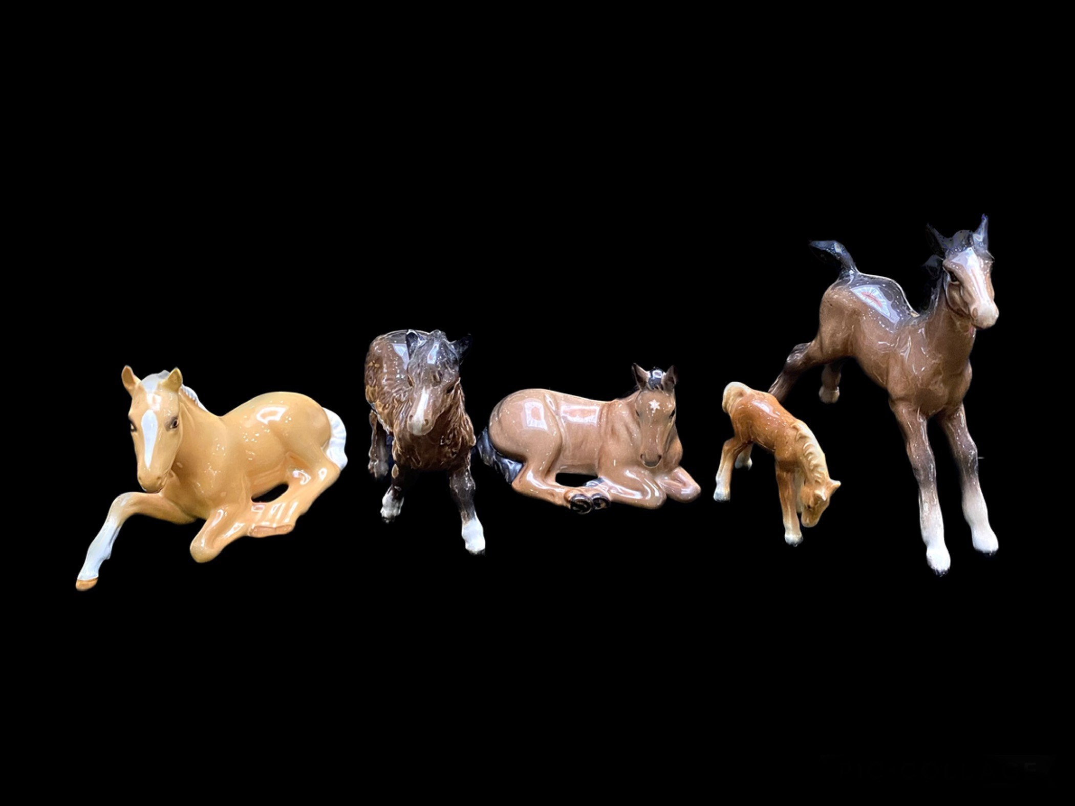 Beswick Horse Animal Figures (5) in total. To include a model of a Palomino foal lying down , number
