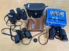 Three Pairs of Vintage Binoculars, comprising a pair of Paragon Paris binoculars in a leather