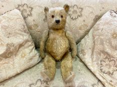 Early 20th Century Teddy Bear. Jointed straw filled glass eyed Teddy Bear circa 1920's.