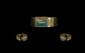 18ct Gold Contemporary Aquamarine and Diamond Set Dress Ring. Marked 750 - 18ct. The Pale Aquamarine