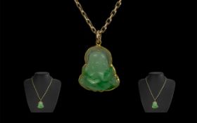 9ct Gold Mounted Jade Buddha Figure / Pendant Attached to a 9ct Gold Chain. Marked 9.375.