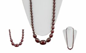 1920's Good Quality Cherry Amber Graduated Beaded Necklace of Long Length. Length 33 Inches.